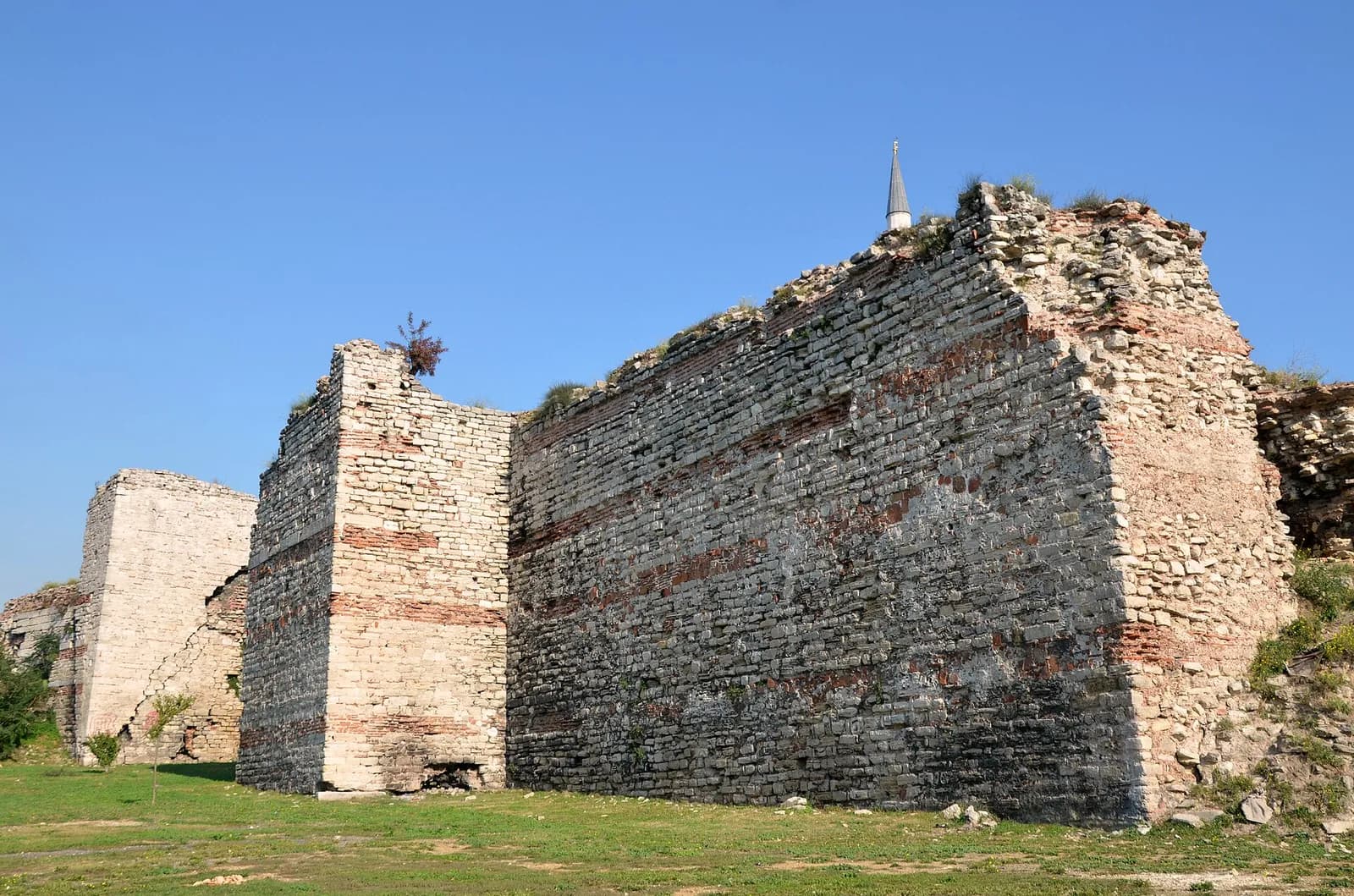 A section of the Theodosian Walls in Istanbul, with towers of stone and brick